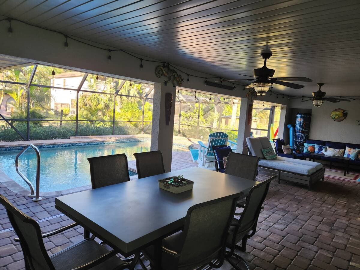 Extra large covered patio with lounger and TV